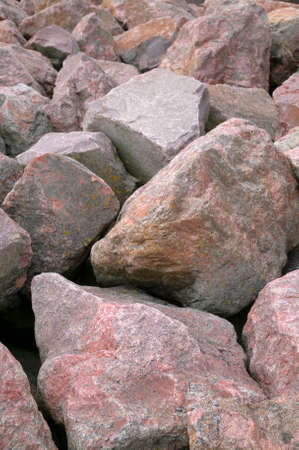 Pink granite boulders piled up on each other.