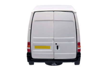 Rear of a model white van with blank door panels for your own branding, isolated on white with clipping path.の写真素材