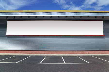 Exterior of a building with a large blank billboard, work path included for the billboard.