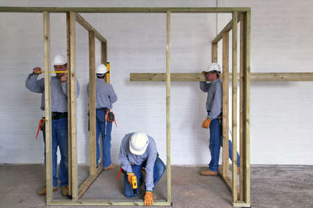 Concept image of a construction worker doing various jobs on a timber framework of a new house...