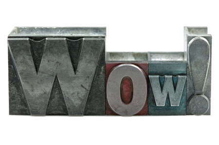 The word WOW! in old letterpress printing blocks isolated on a white background.の写真素材