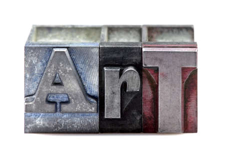 The word Art in old letterpress printing blocks isolated on a white background.