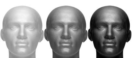 Three mannequin heads in white black and grey, isolated against a white background.の写真素材