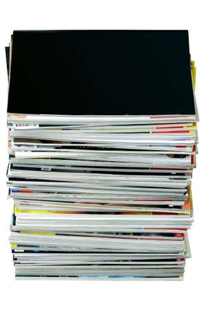 Stack of magazines isolated on white, top magazine is blank for your own design.の写真素材