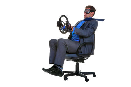 Concept image of a businessman driving along whilst sat in an office chair, isolated on a white background.の写真素材