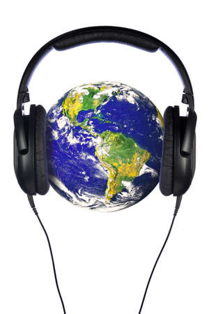 A pair of headphones on the world, globe courtesy of NASA public domain images. Isolated on a white background.の写真素材