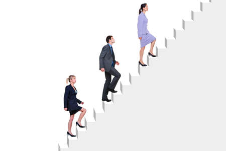 Three business people climbing a flight of stairs, white background.