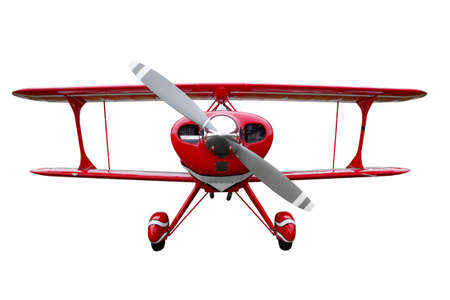 A red biplane isolated on a white background.の写真素材