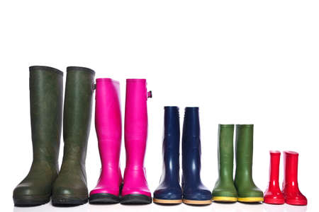 A group of wellie boots isolated on a white background.の写真素材