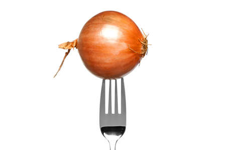 Photo of a brown onion on a fork isolated on a white background, part of a series.の写真素材