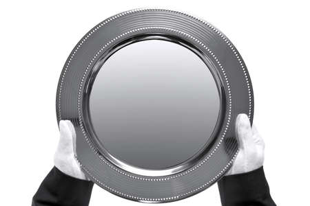 silver tray being held by a butler, shot from above and isolated on a white background. の写真素材