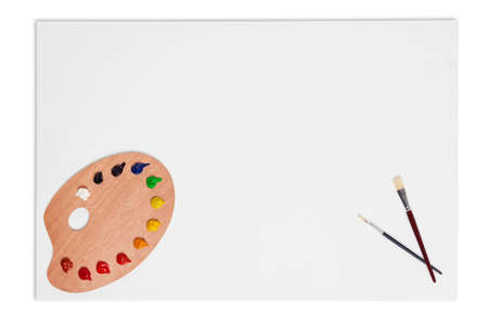  an artists blank canvas with brushes and paint palette  の写真素材