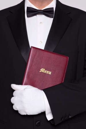 Waiter holding a Menu folder in a restaurant.