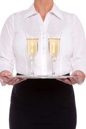 Waitress serving glasses of Champagne on a silver tray, isolated on a white background.の写真素材