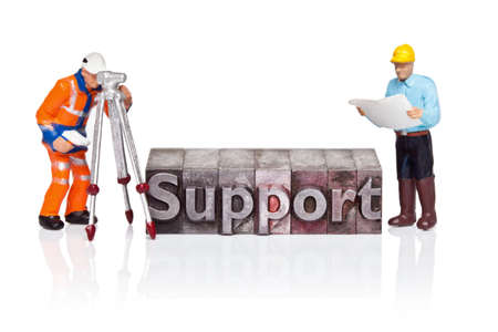 Hand painted figurines and the word Support in old metal letterpress isolated on a white background.の写真素材