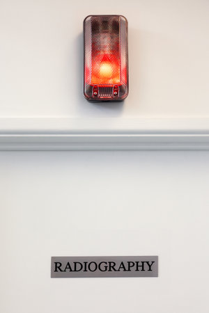 Radiography door with illuminated red light above.の写真素材