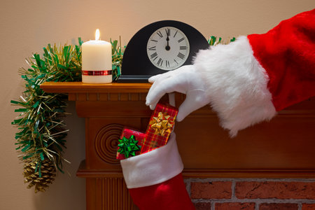 Midnight on Christmas Eve and Santa Claus (or Father Christmas) has come down the chimney to deliver...