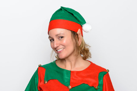 Portrait of an Elf wearing her daily work outfit for working in Santa's workshop at the North Pole.