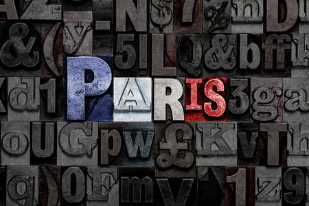 The word Paris made from old metal letterpress letters with the colours of the French flagの写真素材