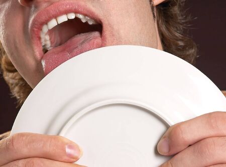 plate lickingの写真素材