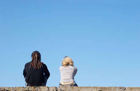 couple sitting under the sky