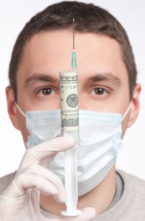 man portrait in mask holding with money syringe closeupの写真素材
