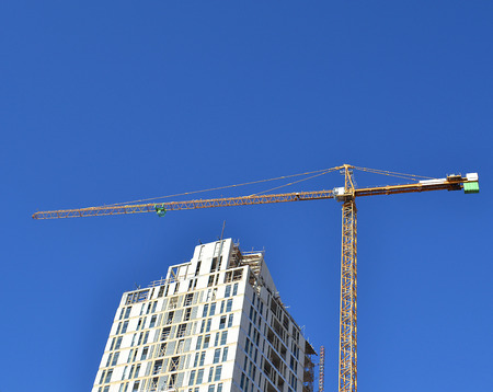 Construction site. Building crane on the blue sky backgroud.の写真素材