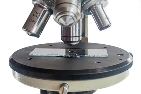 Isolated image of microscope with blood sample macro