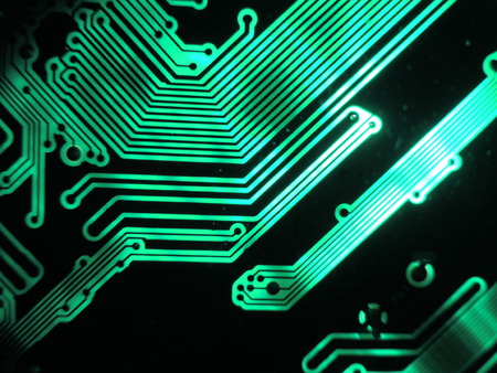 Green glowing patterns of a printed circuit board