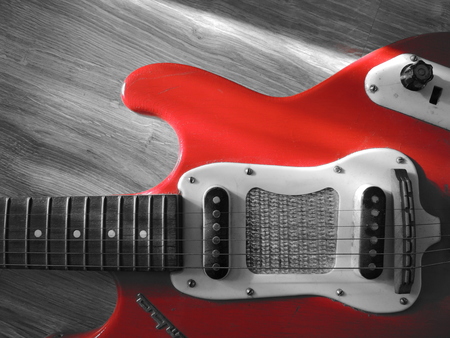 Piece of an old and used electric guitarの写真素材