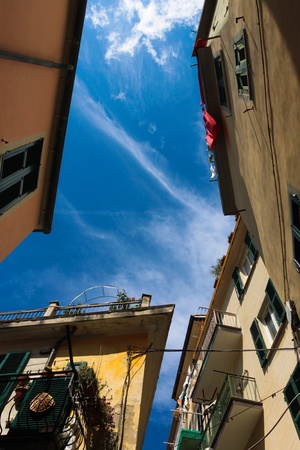 View from the ground in little italian village  on the coast of Liguria provinceの写真素材