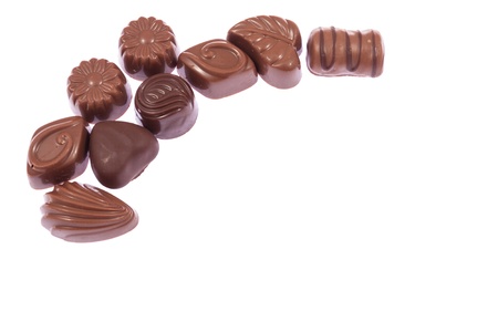 Milk chocolate candies isolated on white backgroundの写真素材