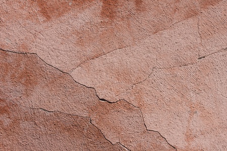 Cracked pink old wall texture backgroundの写真素材