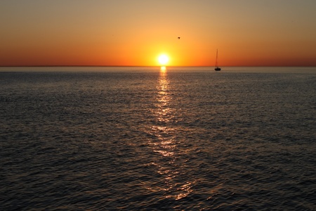 Boat sunset silhouetteの写真素材