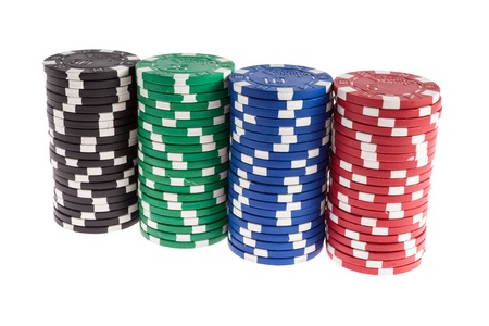Black, green, blue and red casino chips isolated on white backgroundの写真素材