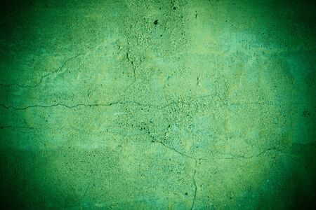 Cracked green concrete wall textureの写真素材