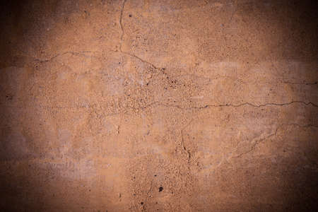Cracked brown concrete wall textureの写真素材