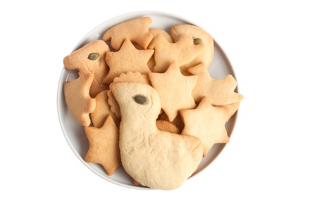 Homemade biscuit cookies on a white plate isolatedの写真素材
