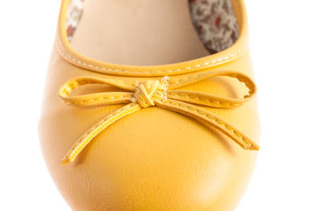 Female yellow shoes isolatedの写真素材