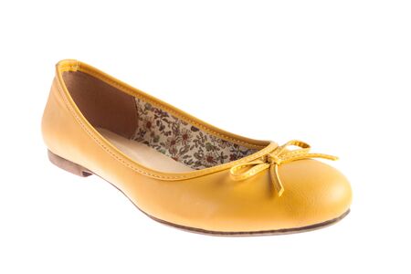 Female yellow shoes isolated on white backgroundの写真素材