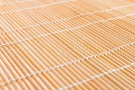 japanese mat, texture of Japanese mat to make sushi on whiteの写真素材