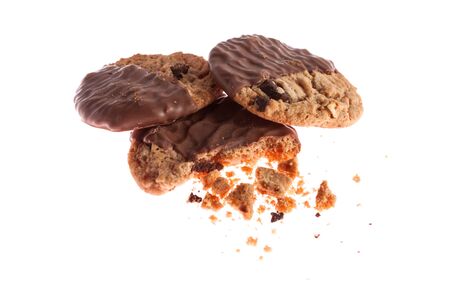 Chocolate cookies with crumbs isolated on whiteの写真素材