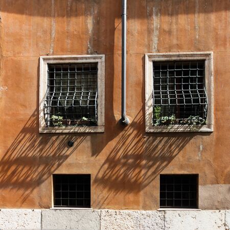 Vintage window and Rain Water Tube, Italyの写真素材