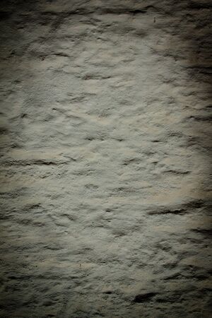 Grey plaster concrete wall wallpaper backgroundの写真素材
