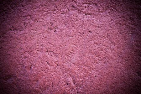 Dark edged pink plaster concrete texture background wallの写真素材
