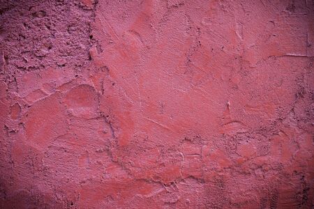 Dark edged pink plaster concrete texture background wallの写真素材