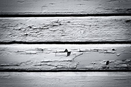 Old weathered black and white wood wall backgroundの写真素材