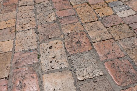 Vintage stone paved avenue street road in old town in Europeの写真素材