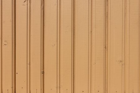 Old yellow painted wooden wall background