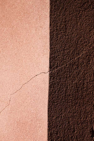 Two sided cracked plaster wall backgroundの写真素材